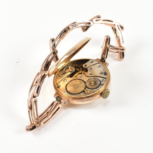 154 - A hallmarked 9ct gold watch with expanding bracelet strap. The gold watch having an enamel dial with... 