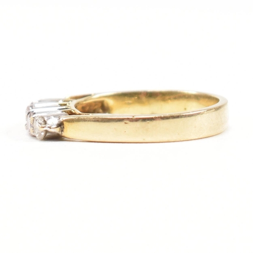 163 - A gold and diamond five stone ring. The ring having a single row of five shared claw set round brill... 