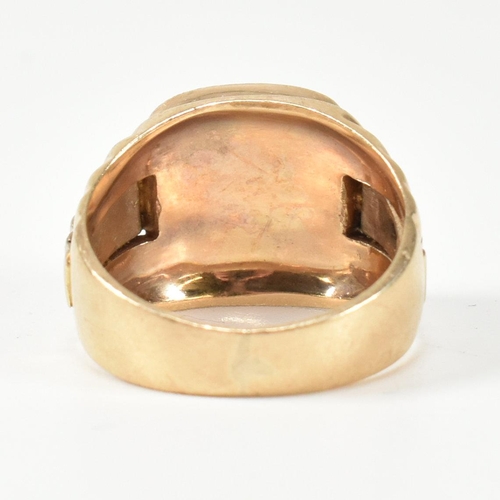 166 - A hallmarked 9ct gold watch strap signet ring. The gold signet ring having a cushion shaped face to ... 