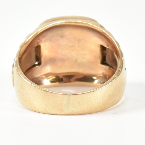 166 - A hallmarked 9ct gold watch strap signet ring. The gold signet ring having a cushion shaped face to ... 