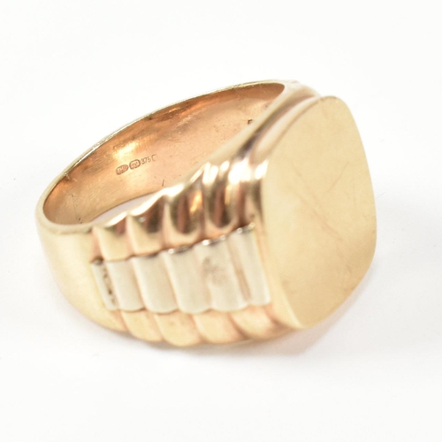 166 - A hallmarked 9ct gold watch strap signet ring. The gold signet ring having a cushion shaped face to ... 