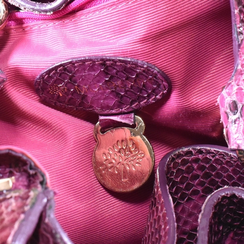 167 - A Mulberry 'Poppy' pink snakeskin handbag. The Mulberry bag having a raspberry snakeskin exterior wi... 