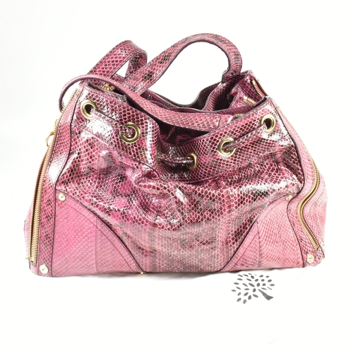 167 - A Mulberry 'Poppy' pink snakeskin handbag. The Mulberry bag having a raspberry snakeskin exterior wi... 