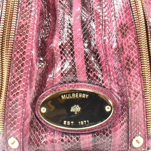 167 - A Mulberry 'Poppy' pink snakeskin handbag. The Mulberry bag having a raspberry snakeskin exterior wi... 