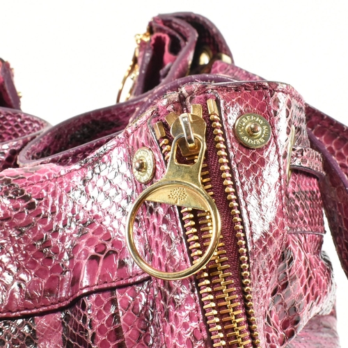 167 - A Mulberry 'Poppy' pink snakeskin handbag. The Mulberry bag having a raspberry snakeskin exterior wi... 