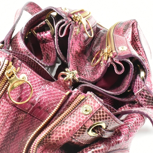 167 - A Mulberry 'Poppy' pink snakeskin handbag. The Mulberry bag having a raspberry snakeskin exterior wi... 