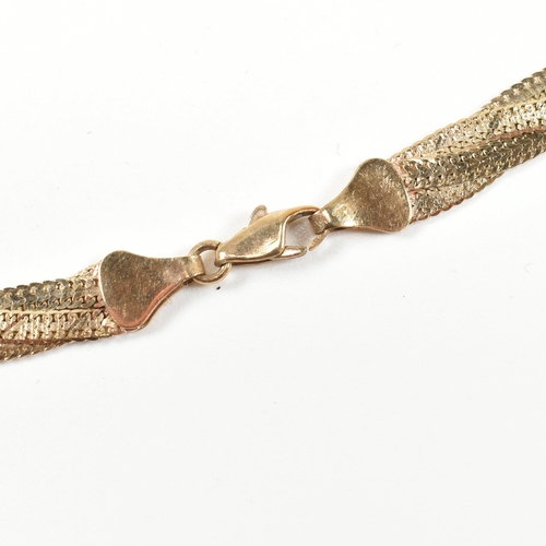 168 - A hallmarked 9ct gold twisted triple herringbone chain necklace. The necklace having three flat herr... 