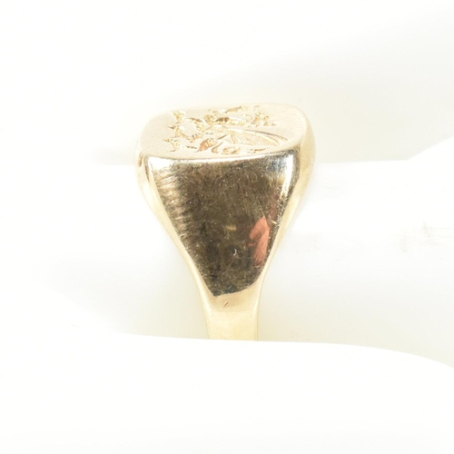 170 - A hallmarked 9ct gold signet seal ring with dragon intaglio. The signet ring having a flat cushion s... 