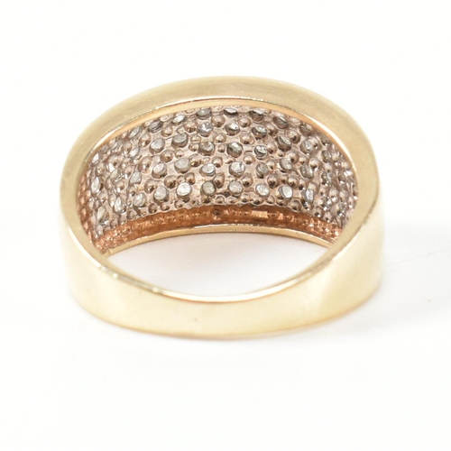 182 - A hallmarked 9ct gold and diamond ring. The 9ct gold ring set with fifty one round cut pave set diam... 