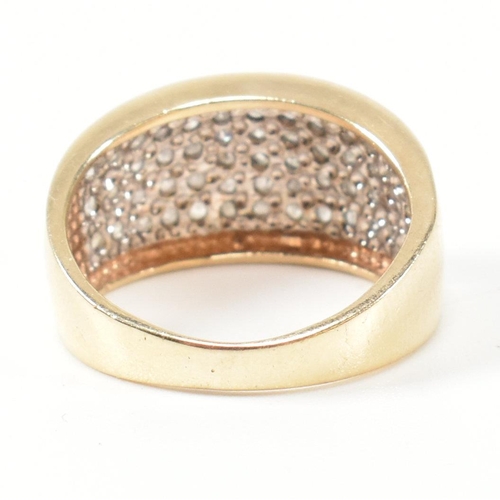 182 - A hallmarked 9ct gold and diamond ring. The 9ct gold ring set with fifty one round cut pave set diam... 