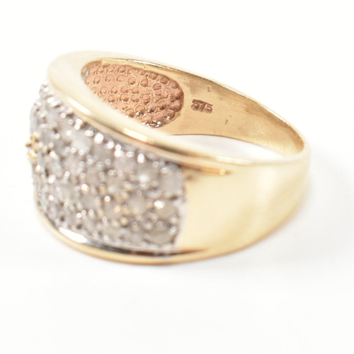 182 - A hallmarked 9ct gold and diamond ring. The 9ct gold ring set with fifty one round cut pave set diam... 