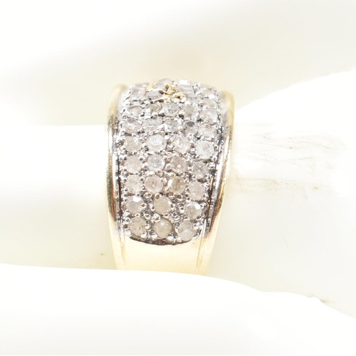 182 - A hallmarked 9ct gold and diamond ring. The 9ct gold ring set with fifty one round cut pave set diam... 