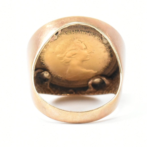 19 - A hallmarked 9ct gold and full sovereign mounted signet ring. The ring set with a full sovereign dat... 