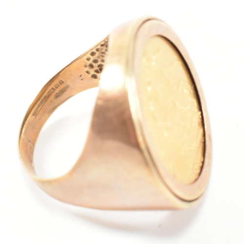 19 - A hallmarked 9ct gold and full sovereign mounted signet ring. The ring set with a full sovereign dat... 