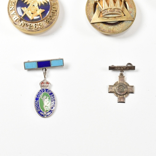 199 - A collection of Masonic jewel medals. The medals to include A hallmarked silver medal with crown mot... 