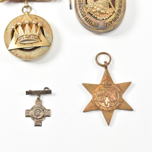 199 - A collection of Masonic jewel medals. The medals to include A hallmarked silver medal with crown mot... 