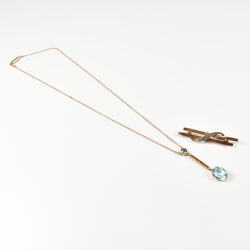 203 - A 9ct gold and blue paste pendant necklace together with a 9ct gold and seed pearl brooch pin. The 9... 