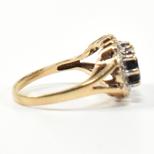 206 - A 9ct gold, sapphire and diamond three stone ring. The ring set with three graduating oval cut sapph... 