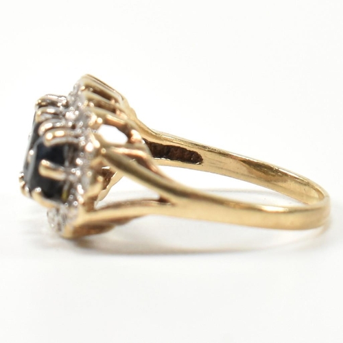 206 - A 9ct gold, sapphire and diamond three stone ring. The ring set with three graduating oval cut sapph... 