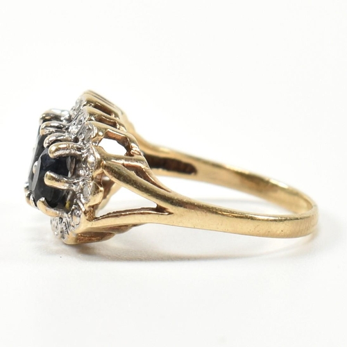 206 - A 9ct gold, sapphire and diamond three stone ring. The ring set with three graduating oval cut sapph... 