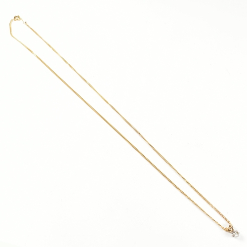 208 - A hallmarked 9ct gold and diamond pendant necklace. The 9ct gold curb link chain necklace strung wit... 