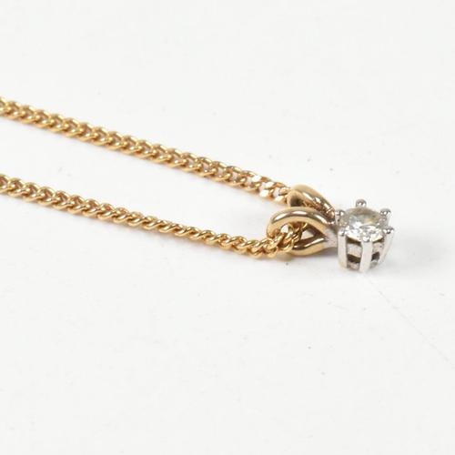 208 - A hallmarked 9ct gold and diamond pendant necklace. The 9ct gold curb link chain necklace strung wit... 