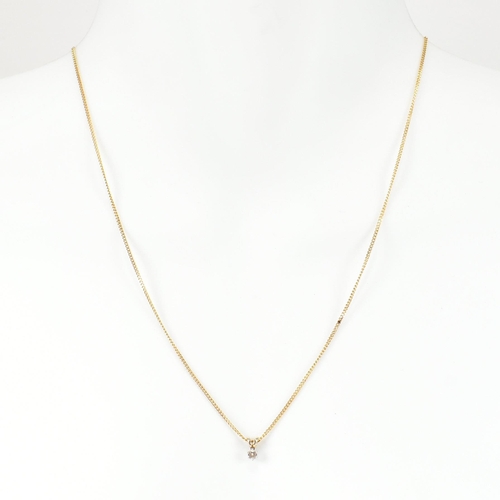 208 - A hallmarked 9ct gold and diamond pendant necklace. The 9ct gold curb link chain necklace strung wit... 