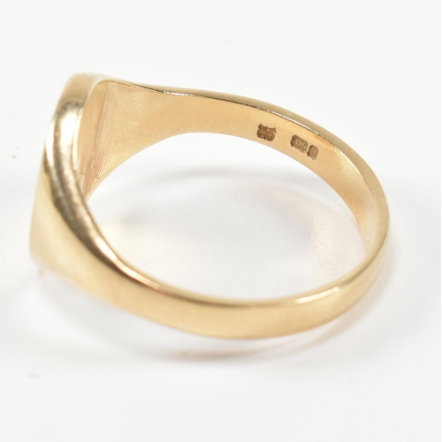 210 - A hallmarked 9ct gold signet ring. The 9ct gold signet ring having an oval face with tapered shoulde... 