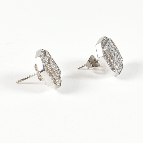 22 - A pair of white gold and diamond Art deco style cluster earrings. Stamped 14K. Measures head 12mm. A... 