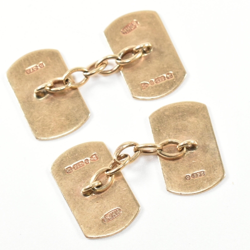 221 - A pair of hallmarked 9ct gold cufflinks. The 9ct gold cufflinks having faces with engine turned desi... 