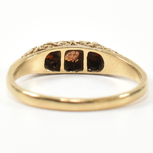 224 - A 1940s hallmarked 9ct gold, opal and garnet three stone gypsy ring. The ring having a central round... 