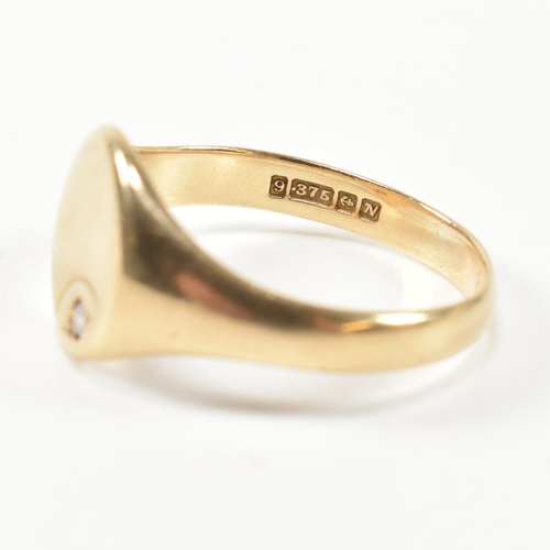 226 - A hallmarked 9ct gold and CZ signet ring. The 9ct gold signet ring having an oval face set to the to... 