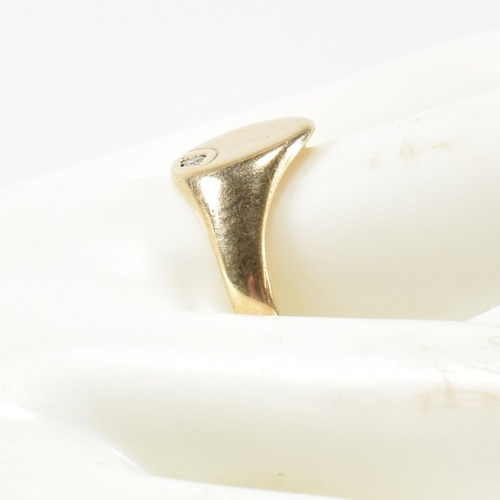 226 - A hallmarked 9ct gold and CZ signet ring. The 9ct gold signet ring having an oval face set to the to... 