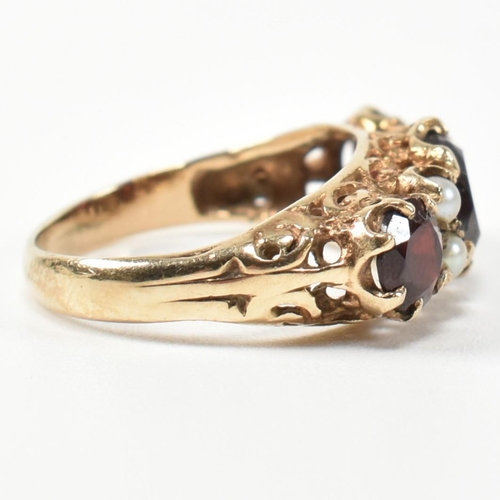 230 - A 1960s hallmarked 9ct gold, garnet and pearl half hoop ring. The ring having three graduating round... 