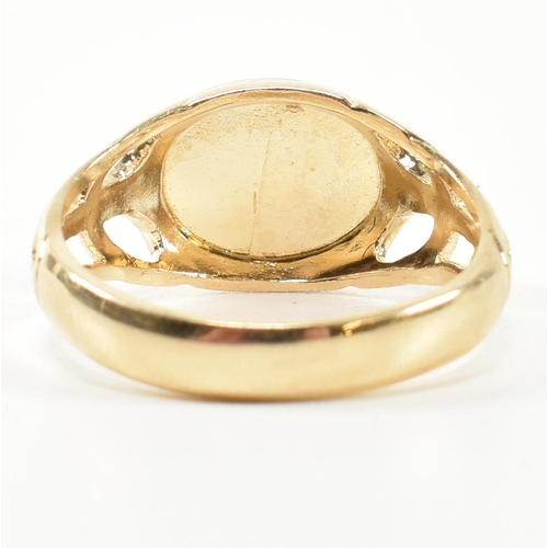 236 - A hallmarked 9ct gold signet ring. The 9ct gold signet ring having an oval face to pierced shoulders... 