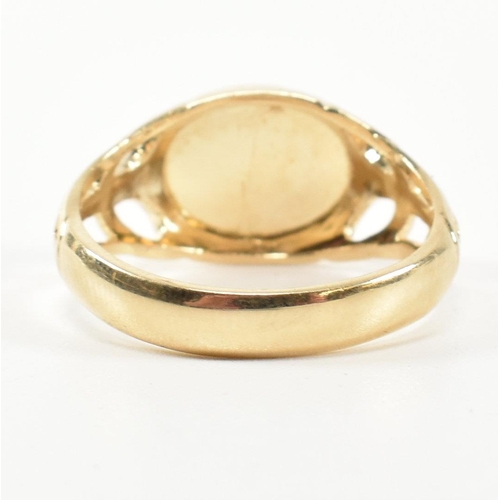 236 - A hallmarked 9ct gold signet ring. The 9ct gold signet ring having an oval face to pierced shoulders... 