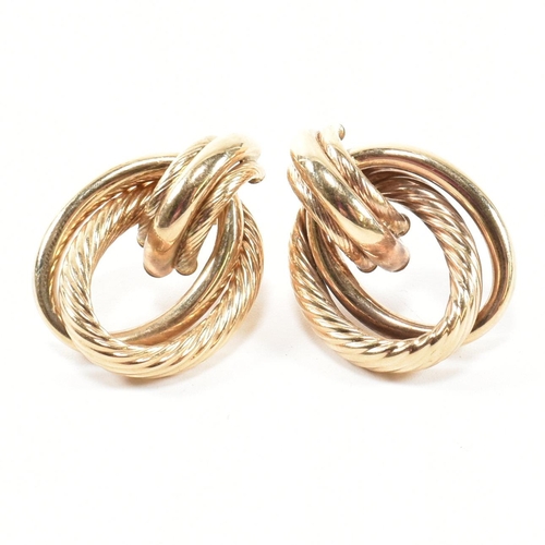 239 - A pair of hallmarked 9ct gold interlocking knot earrings. The earrings having an interlocking knot d... 