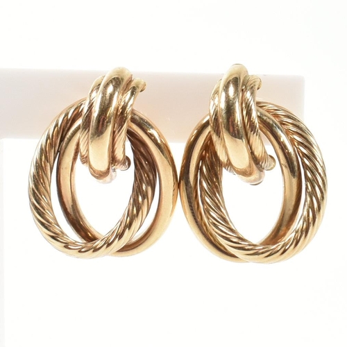 239 - A pair of hallmarked 9ct gold interlocking knot earrings. The earrings having an interlocking knot d... 