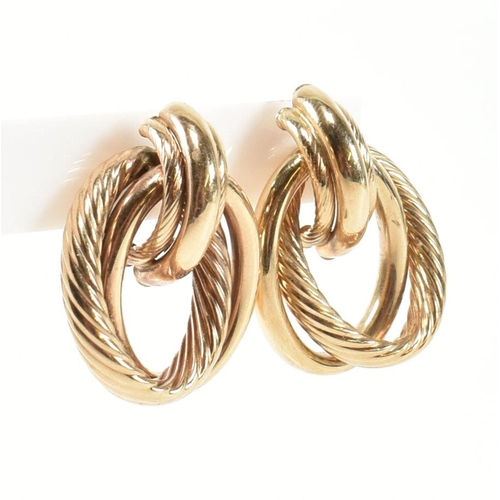 239 - A pair of hallmarked 9ct gold interlocking knot earrings. The earrings having an interlocking knot d... 