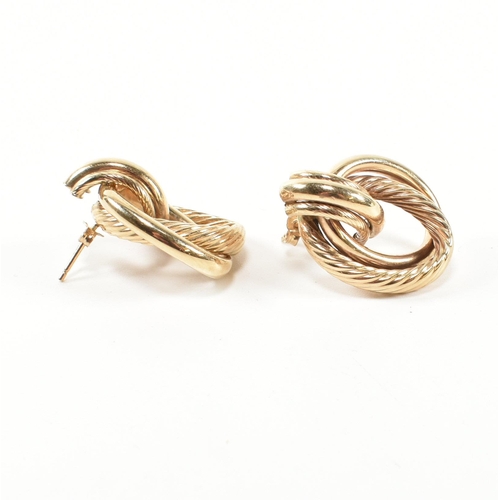 239 - A pair of hallmarked 9ct gold interlocking knot earrings. The earrings having an interlocking knot d... 