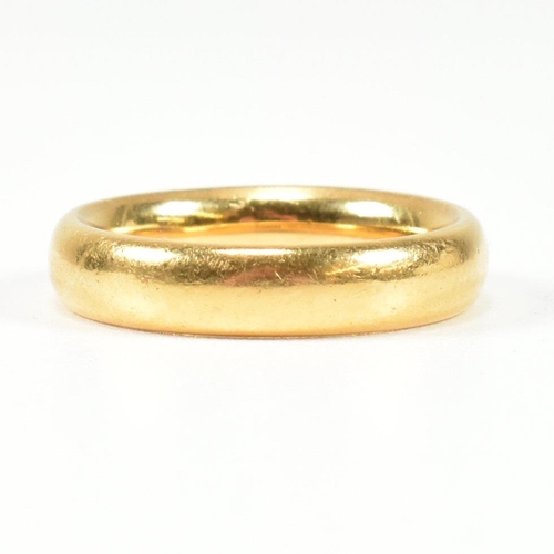 24 - A hallmarked 22ct gold band ring. Hallmarked for London, 1921. Size K.5-L. Weighs 7.6g. All weights,... 