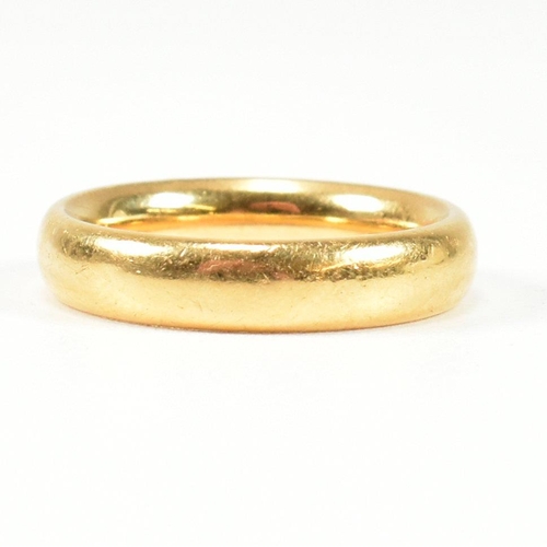 24 - A hallmarked 22ct gold band ring. Hallmarked for London, 1921. Size K.5-L. Weighs 7.6g. All weights,... 