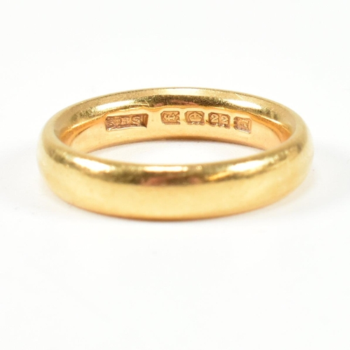 24 - A hallmarked 22ct gold band ring. Hallmarked for London, 1921. Size K.5-L. Weighs 7.6g. All weights,... 