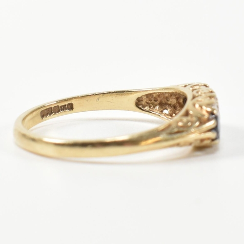 243 - A hallmarked 9ct gold, diamond and sapphire half hoop ring. The antique style ring having three grad... 