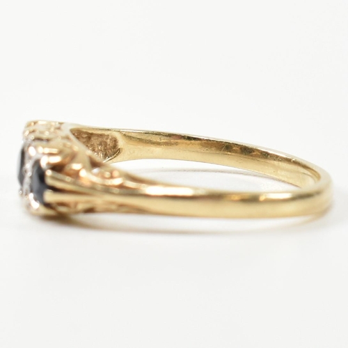 243 - A hallmarked 9ct gold, diamond and sapphire half hoop ring. The antique style ring having three grad... 