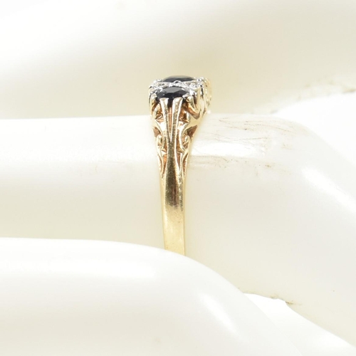 243 - A hallmarked 9ct gold, diamond and sapphire half hoop ring. The antique style ring having three grad... 