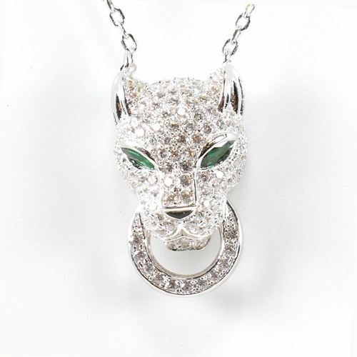 246 - A 925 silver and CZ pendant necklace in the form of a leopard's head. The silver necklace strung wit... 