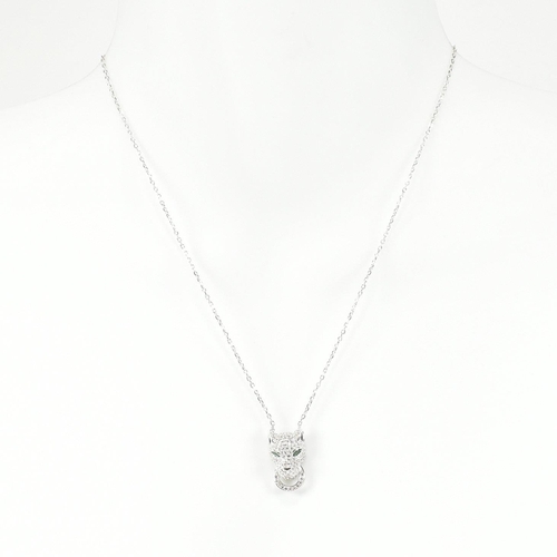 246 - A 925 silver and CZ pendant necklace in the form of a leopard's head. The silver necklace strung wit... 