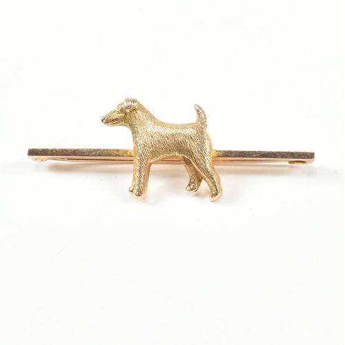 25A - An early 20th century 9ct gold terrier dog bar brooch pin.  The brooch having a terrier motif to bar... 