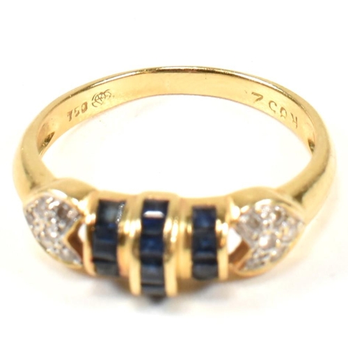 250A - An 18ct yellow gold sapphire and diamond ring. The ring having central domed calibre cut sapphires t... 